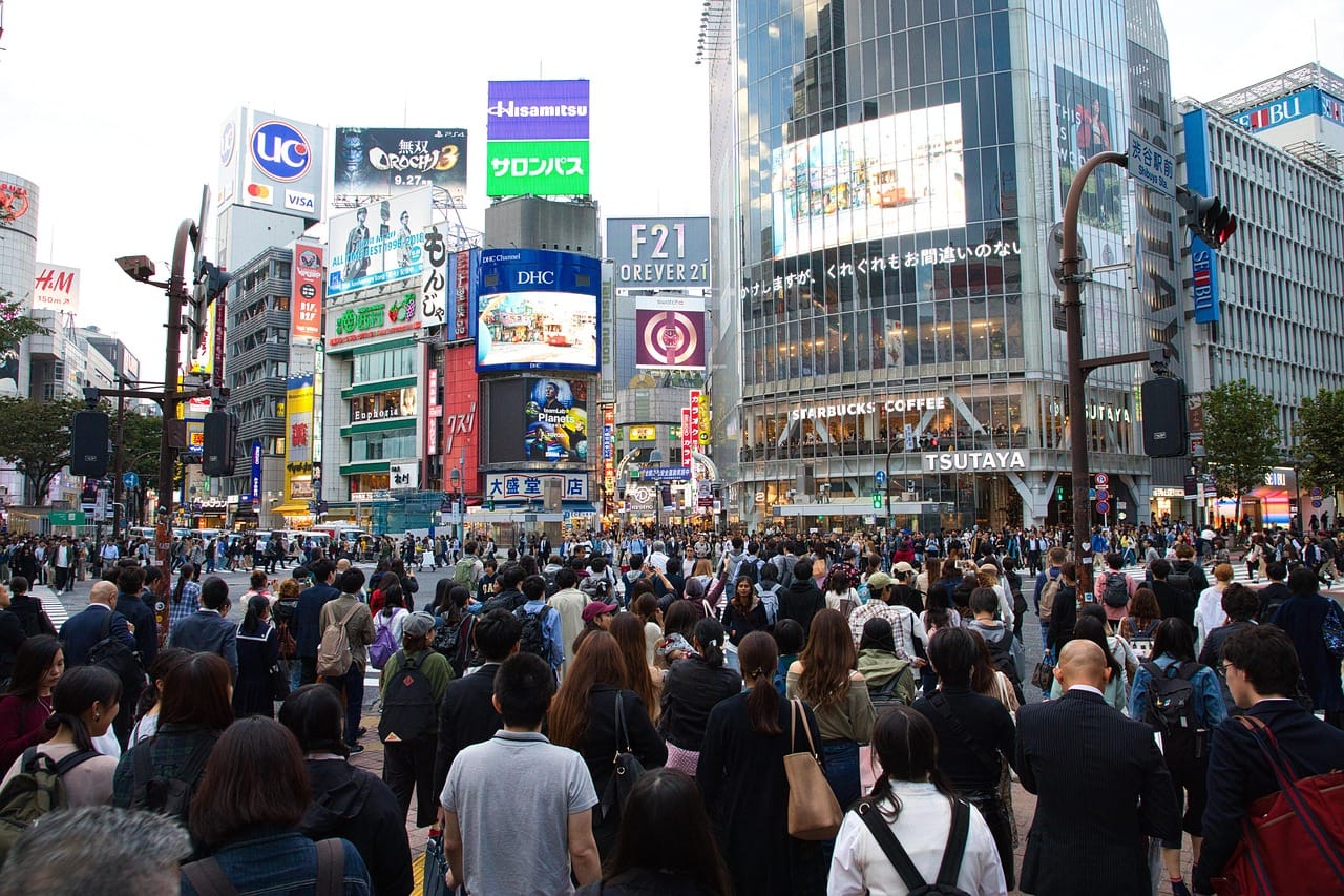 Shibuya crossing in the evening rush. By 1am, it belongs to a few dozen people.